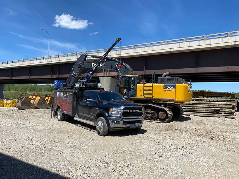 mobile service truck working on an excavator